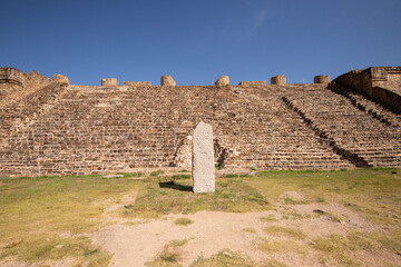 Columns and carved stone at the ancient ruins of Monte Alban in Oaxaca, Mexico.