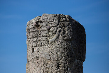Columns and carved stone at the ancient ruins of Monte Alban in Oaxaca, Mexico.