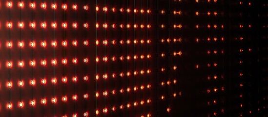 Red LED wall background with horizontal light patterns on a dark black surface, creating an abstract visual effect perfect for modern design.