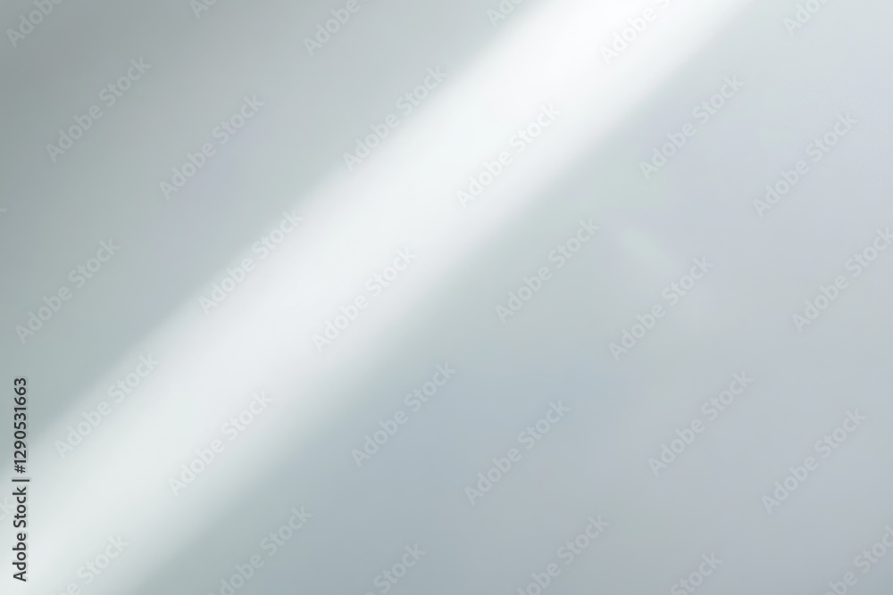 Poster a soft, diffused light diagonally crosses a light gray background, creating a subtle gradient.