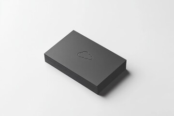 A stack of dark gray business cards with a subtly embossed cloud icon sits on a white surface.