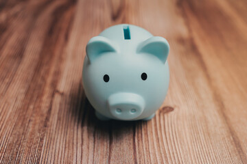 Cute Blue Piggy Bank on Wooden Table for Saving Money Concept, Business concept