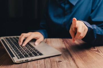 Close-Up of Hands Using Laptop with Focused Gesture in Office Setting, Business concept