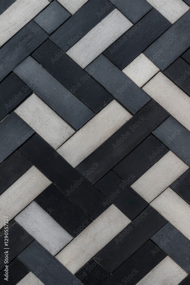 Poster close up on herringbone pattern of alternating light & dark tiles for background
