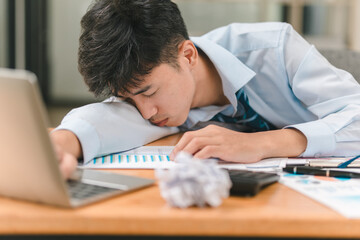 Naklejka premium Overworked businessman struggles to stay awake at office desk modern workspace stressful environment