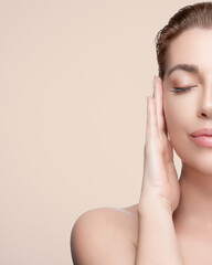 Woman enjoying a facial massage with a gua sha tool