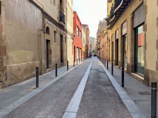 Narrow cobblestone alley with colorful buildings in a Mediterranean town, symbolizing travel and exploration