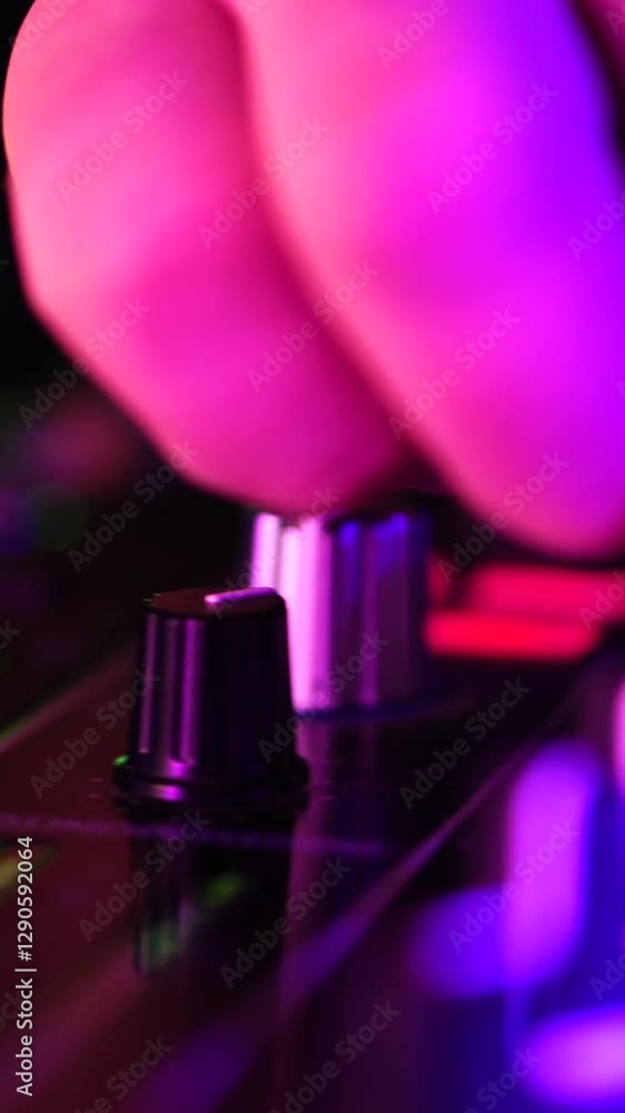 Poster dj playing music on controller console with turntables and faders, close up