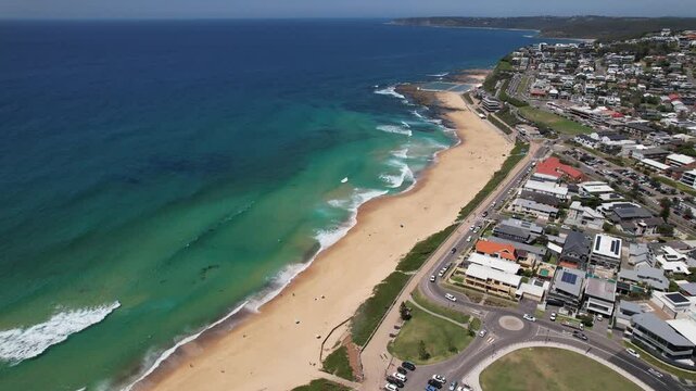 Merewether Beach With Luxury Beachfront Homes In Newcastle, NSW, Australia. aerial arc shot
