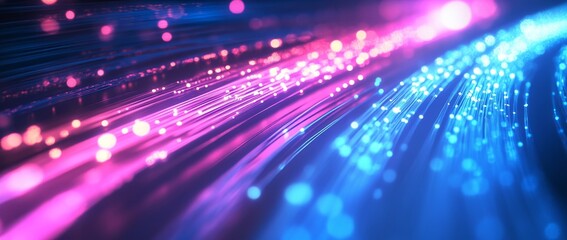 Spinning blue and pink light in a digital tunnel full of data cables and fiber optics creating a vibrant abstract atmosphere