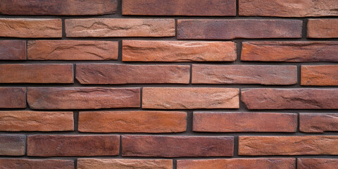 Obraz premium Modern brick wall texture with warm tones and natural variations, perfect for backgrounds or design elements. This contemporary surface adds character and depth to any space