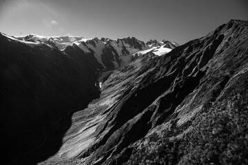 Flying over the southern alps mountain range snow covered peaks