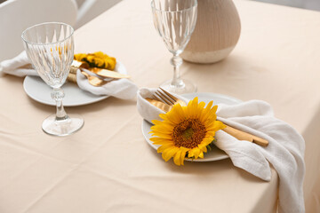 Modern table setting with sunflowers. Closeup