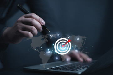 Plan business goal business development to success action for buyer persona and target customer concept. Businessman shows target icon in of front laptop, strategy, success