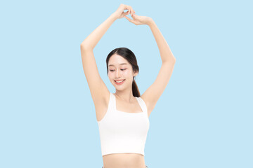 Fototapeta premium Beautiful young Asian woman lifting hand up to shows off clean and clear armpit or underarms isolated on blue background, Smooth and freshness armpit concept. 