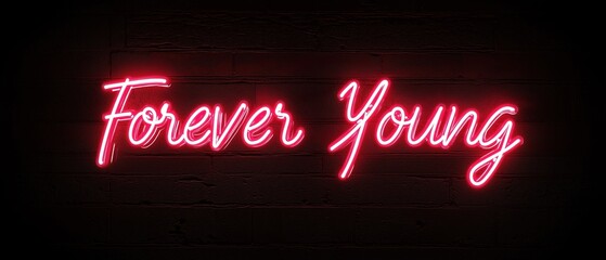 Neon sign that reads "forever young" in a bold, cursive font. the sign is lit up in a bright pink color, standing out against a dark brick wall background.