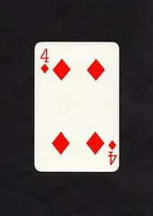 A diamonds playing card isolated on a black background.