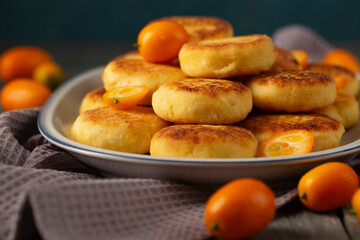 Delicious cheesecakes with delicious kumquats in a plate