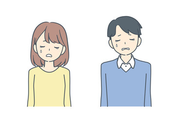 悲しそうに俯く男性と女性