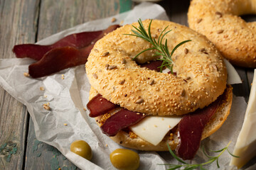Burger with cheese, basturma and rosemary