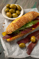 Burger with ciabatta with turmeric and bastrum