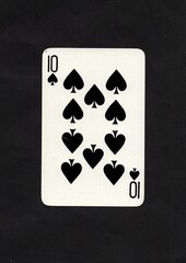 A spades playing card isolated on a black background.