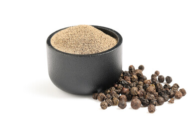 Bowl with black pepper powder and peppercorns on white background