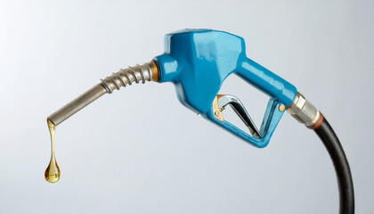 Fuel nozzle with dripping petroleum, isolated white backdrop. Oil industry, gasoline.