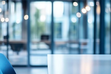Blurred office interior with glass walls and white tables, blurred background of a modern open space in the business center, blurred view from outside through the window, focus on the table surface.