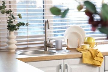 Yellow napkin with dishes on counter in kitchen