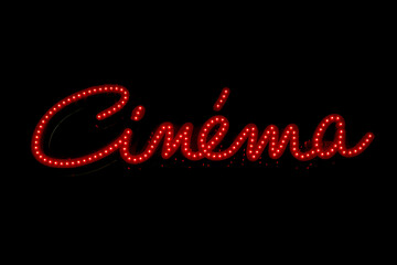 Néon fluorescent rouge qui signale un cinéma