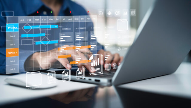 Project management tool concept. Business people use laptop to manager working projects and update task with Gantt chart schedule to Business plan and progress. Planning software.