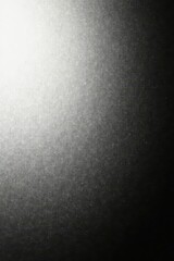 Subtle monochrome gradient, textured with film grain , smooth, seamless, abstract