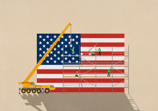 Crane and construction workers on scaffolding moving stars on American flag
