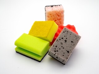 Assorted cleaning sponges on white background