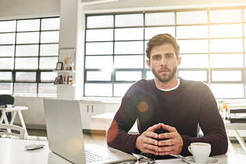 Portrait, business and man at desk, laptop and hands together with confidence in modern office....