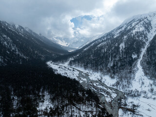 Obraz premium Beautiful high altitude snow capped mountain and forest in Tibet, China