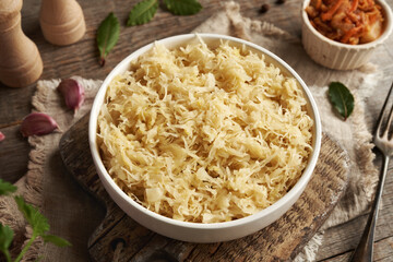 Fermented cabbage or sauerkraut in a white bowl