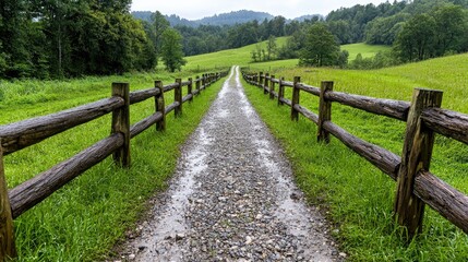 Gravel path, wooden fence, green hills, rural landscape, nature scene