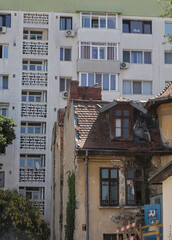 Obraz premium Contrast between historical architecture and modern buildings in Bucharest Romania highlights urban development struggles