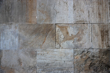 Textured stone wall showcasing variations in shade and pattern in Bucharest, Romania