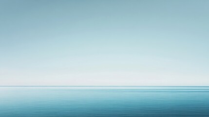 Obraz premium Blue ocean horizon with a calm sky, tranquil water surface, minimalistic landscape, serene nature backdrop, peaceful seascape view.