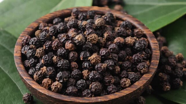 Dried peppercorn in a wooden bowl