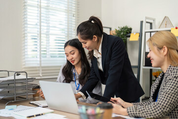 Business professionals reviewing financial data and strategies in a collaborative office environment.