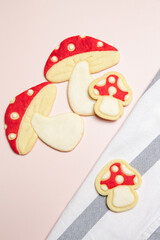 Thin homemade biscuits. Woodland red mushroom with white dots. Sugar cookies for party, Easter or baby shower.	