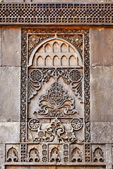 Beautiful floral motif carvings on a wall of Siddi Sayyed Mosque, Ahmedabad, Gujarat, India.