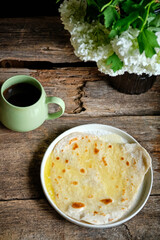 Honey flatbread. Wooden background, side view.
