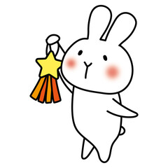 七夕の飾り付けをしている白いうさぎ