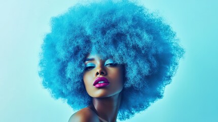 Fototapeta premium Portrait of a woman with vibrant blue afro hairstyle, colorful makeup, and artistic lighting, showcasing modern beauty and fashion trends.
