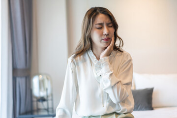 Asian woman suffering from toothache, oral health issues, dental pain and cavity problems, oral...